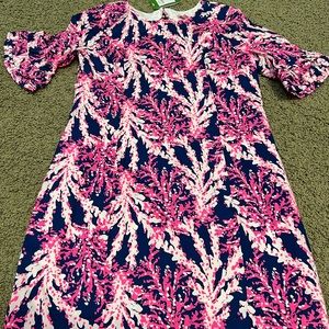 Never worn. Ruffles on sleeves and back keyhole. So cute!!